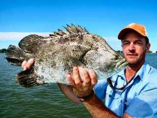 Jeff-Currier-with-a-tripletail-in-Belize